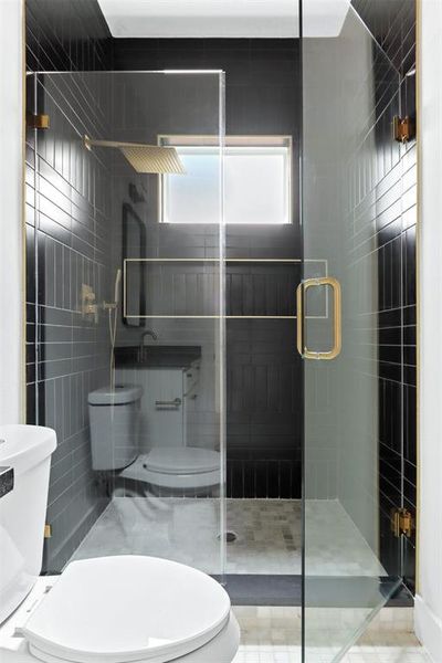 Bathroom featuring toilet and walk in shower