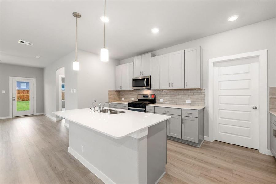 Experience seamless living in this open floor plan living room, featuring an inviting eat-in kitchen that’s perfect for entertaining. The spacious layout promotes easy flow between the kitchen and living area, creating an ideal setting for gatherings and everyday enjoyment.