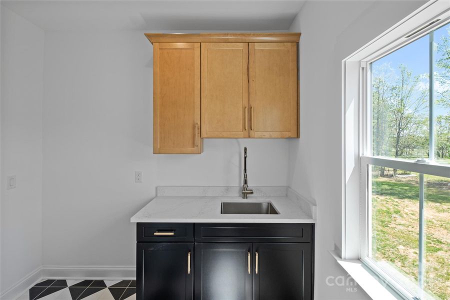 Luxurious design extends to upper level laundry room