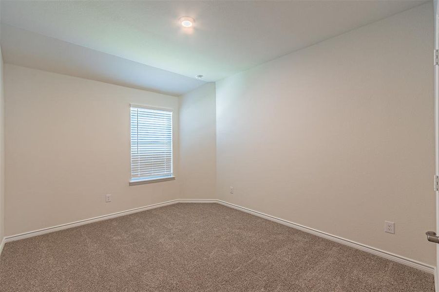 Spare room with carpet floors