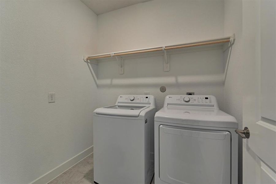 Well suited laundry room with washer and dryer included!