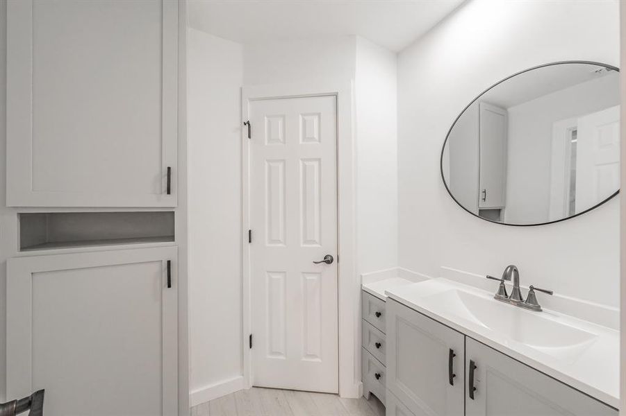 Bathroom featuring vanity and hardwood / wood-style flooring