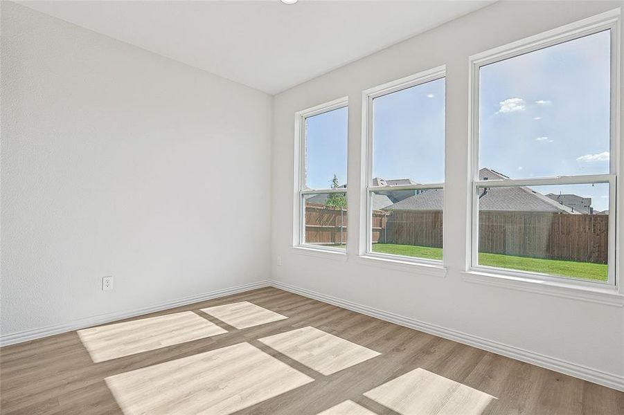 Empty room featuring light wood-type flooring