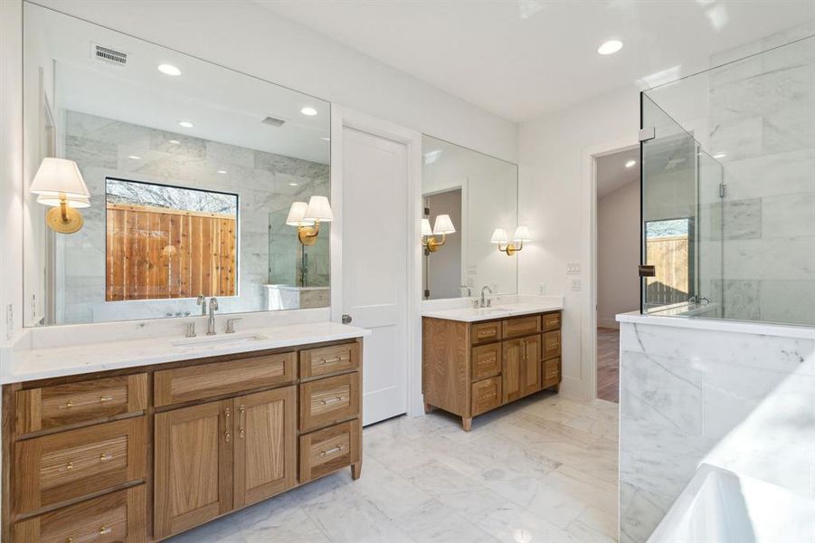 Bathroom featuring vanity and an enclosed shower