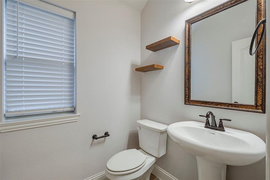 Bathroom featuring toilet and sink