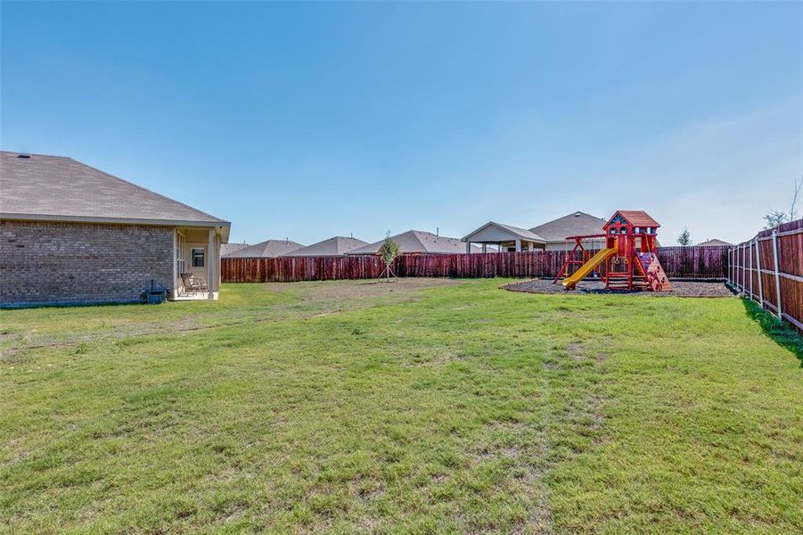 View of yard with a playground