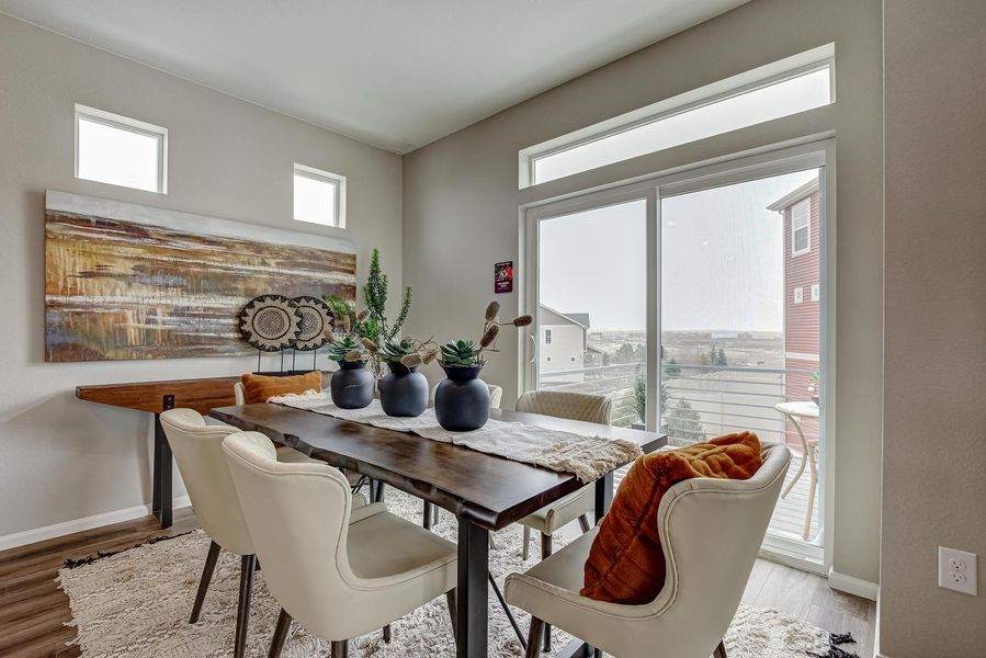 Adjacent to the kitchen, the dining room offers a seamless transition for hosting memorable gatherings, with a sliding glass door leading to a deck where you can dine al fresco or simply soak in the sunshine.