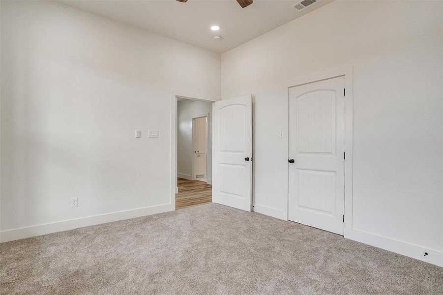 Bedroom featuring carpet flooring and ceiling fan