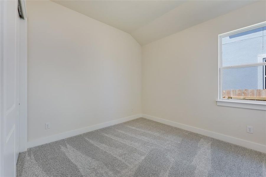 2 good sized secondary bedrooms in their own hallway across from the kitchen area.