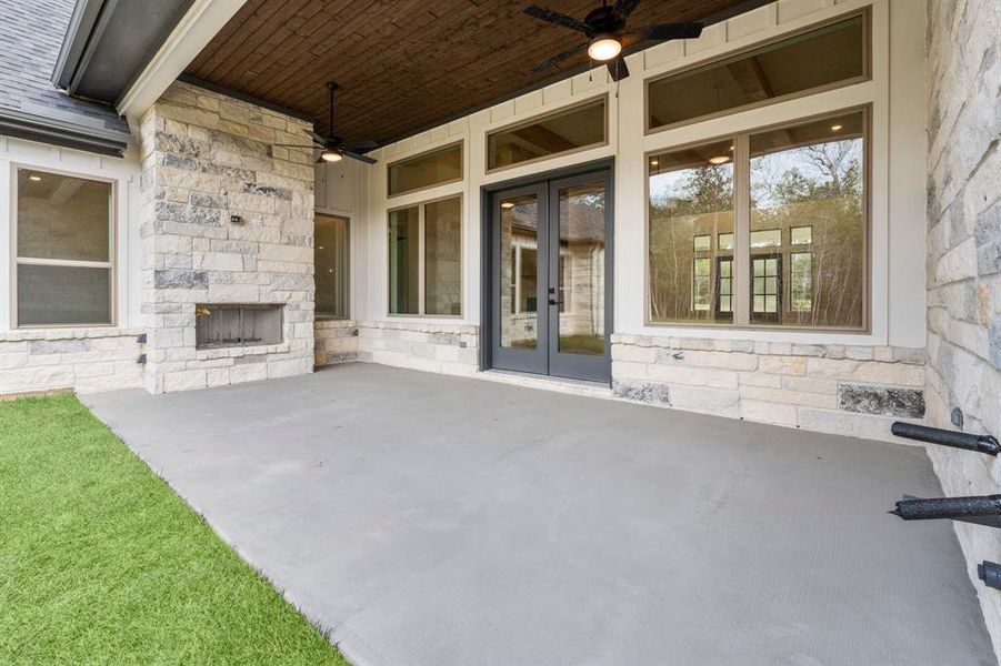 Covered Rear Patio with Wood Burning Fireplace and Pre-plumbing for Gas, Water, and Electricity