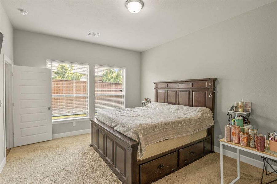 Bedroom with light carpet