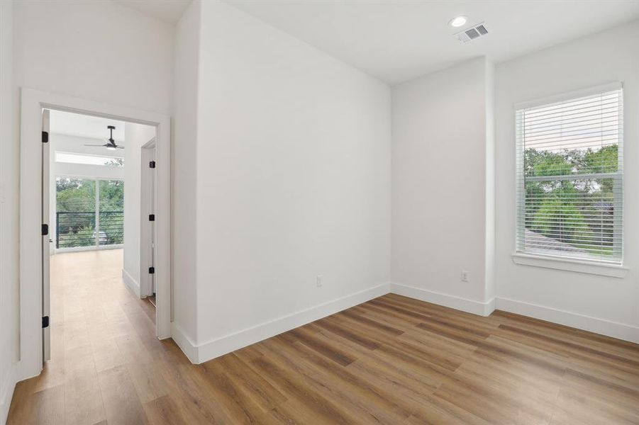 Upstairs, second story den leading into primary bedroom ensuite.