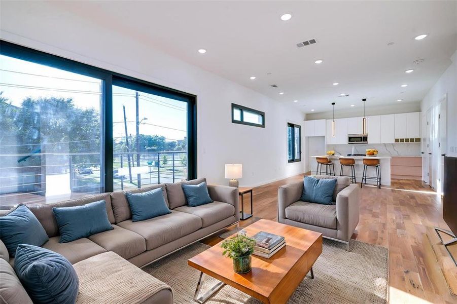 Living room with light hardwood / wood-style flooring