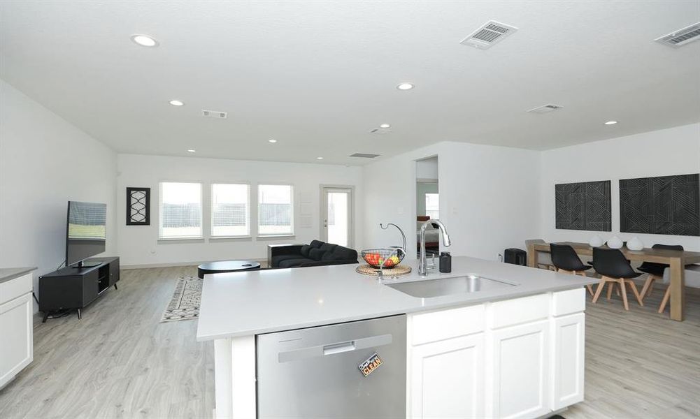 Kitchen is open to the family room with views of the back yard.