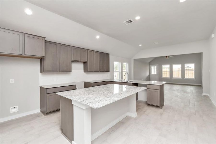 Welcome to a dream kitchen that exceeds expectations! Sample photo of completed home with similar floor plan. As-built interior colors and selections may vary.