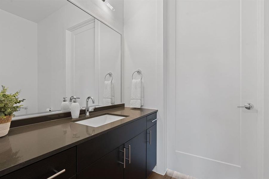 First floor powder bath opens to the commercial and private living space.