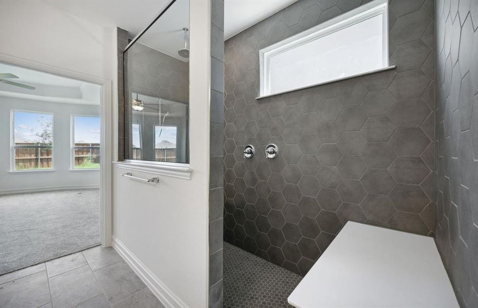 Oversized shower in owner's bath*real home pictured