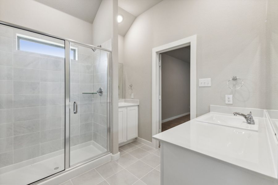 Primary Bathroom in the Pecan home plan by Trophy Signature Homes – REPRESENTATIVE PHOTO