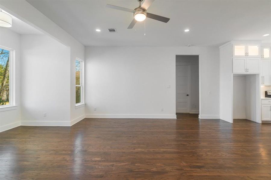 Unfurnished room featuring ceiling fan and hardwood / wood-style floors