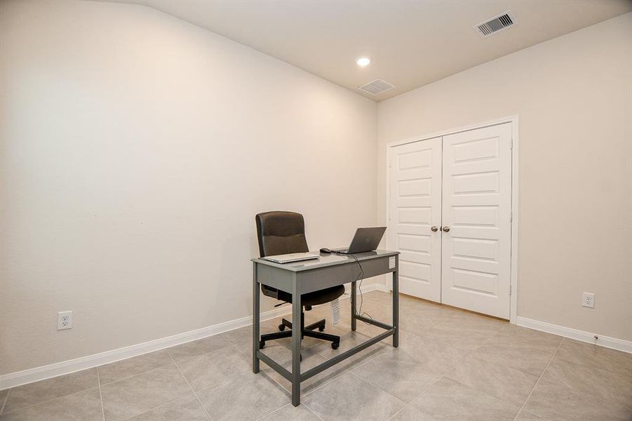 The space is versatile and can serve as a quiet work area or media room.