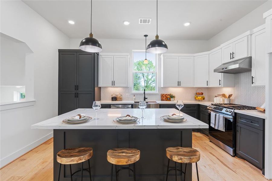 The spacious dining area effortlessly accommodates large gatherings, highlighting the home's generous proportions while providing an inviting setting for memorable feasts and celebrations.