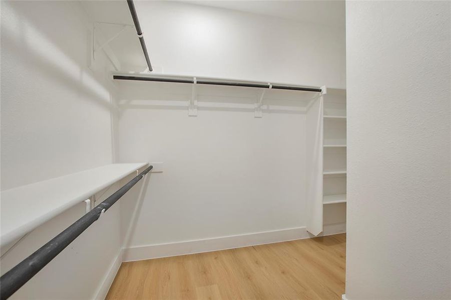 Walk in closet featuring light wood-type flooring