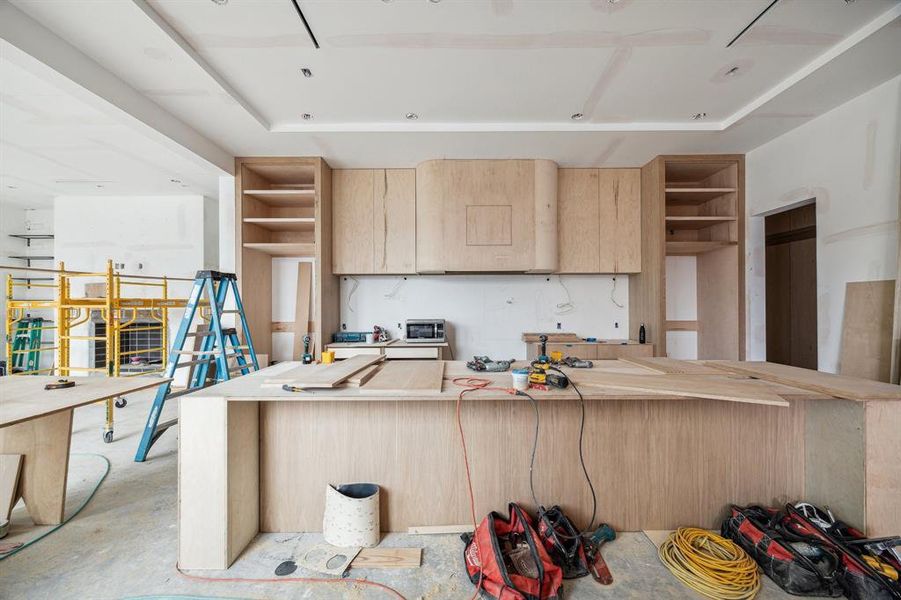 Island Kitchen with Two-Toned Stained Cabinetry and Flat Panel Doors plus a Scullery Kitchen.