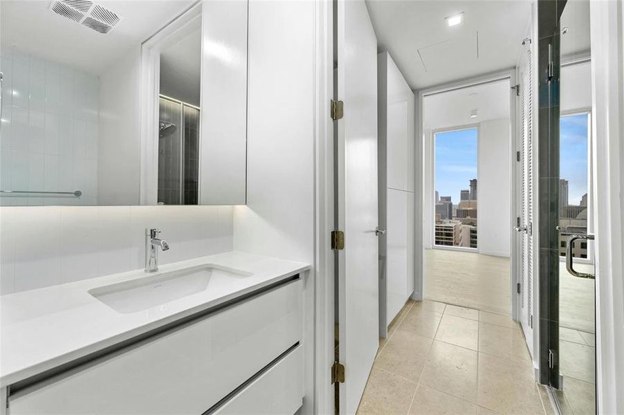 The second bathroom mirrors the elegance of the primary bath, seamlessly incorporating the home's overall aesthetic with matching features and finishes. *Linden Residence No. 2105 Shown Here