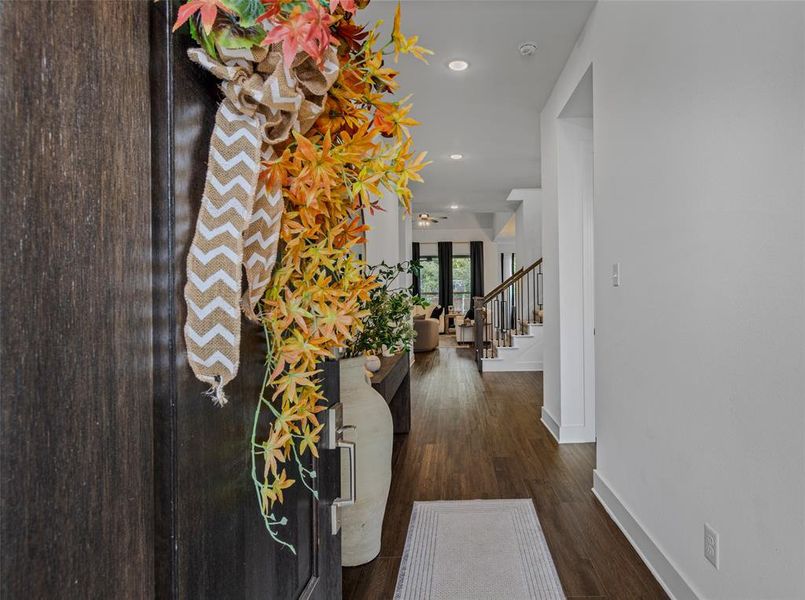 Entryway with dark wood-type flooring