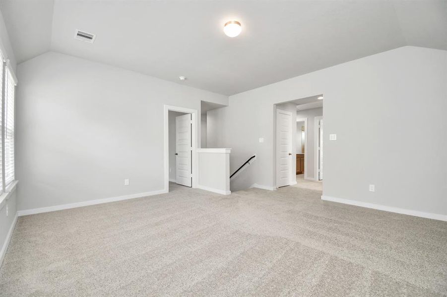 Take another look at this beautiful and spacious loft area, perfect for a game room! Sample photo of completed home with similar floor plan. Actual colors and selections may vary.