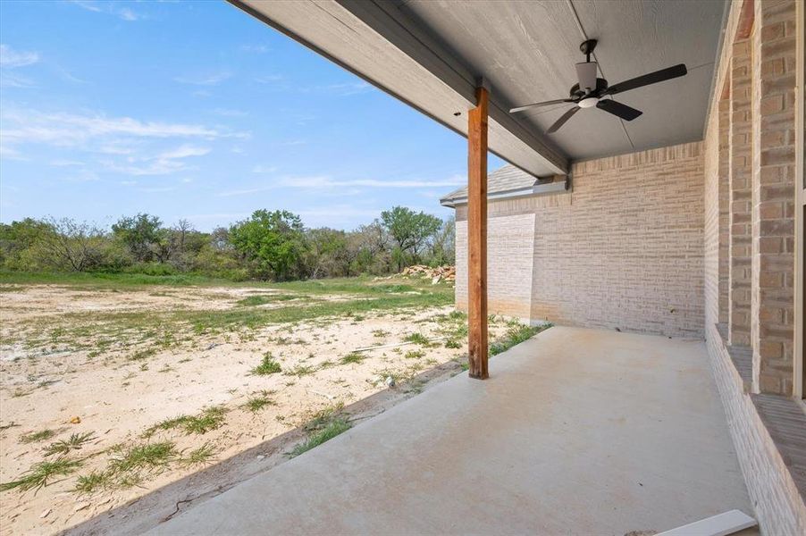 View of patio featuring ceiling fan