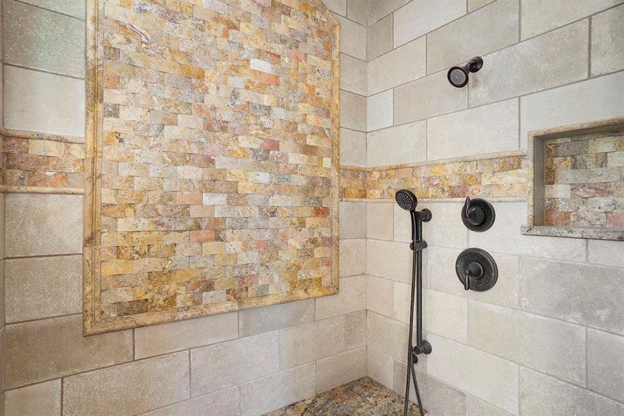 Bathroom featuring a tile shower