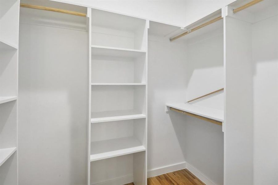 Spacious closet featuring hardwood / wood-style floors