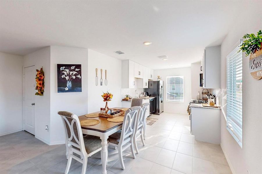 Tiled dining space with plenty of natural light