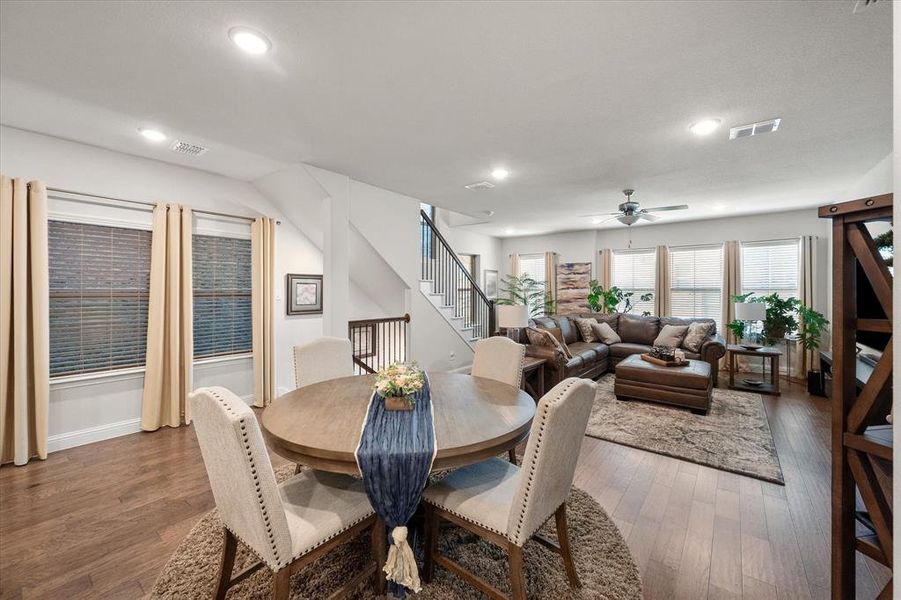 Dining room featuring ceiling fan and dark hardwood / wood-style floors