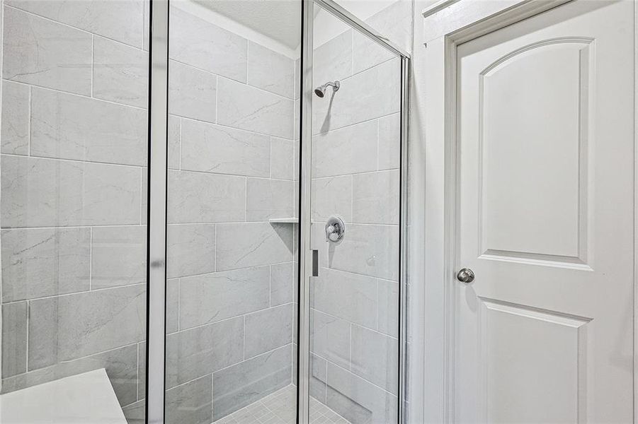 Bathroom featuring walk in shower