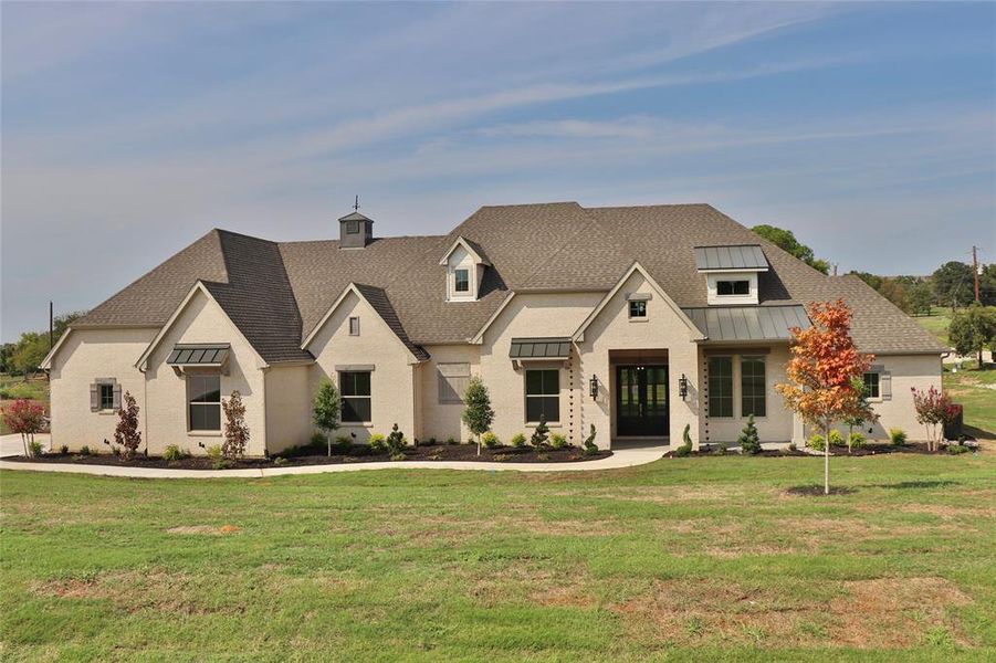 View of front of home with a front yard