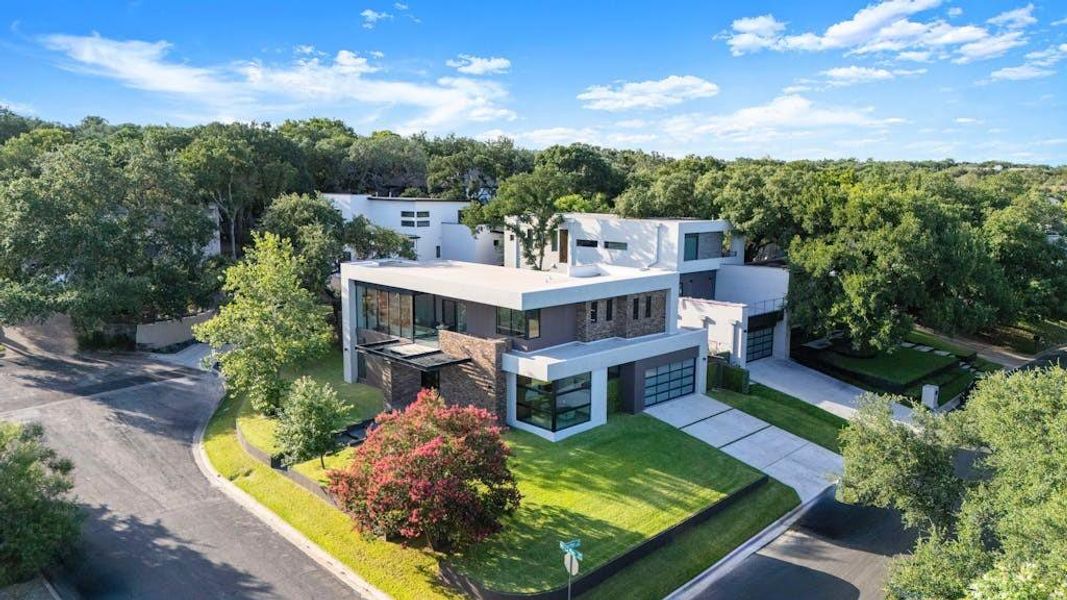 Capture the expansive dimensions of this impressive property from a breathtaking aerial perspective.