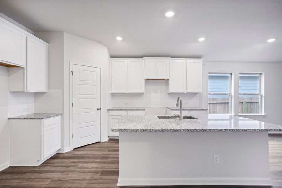 Kitchen in the Allen floorplan at a Meritage Homes community.