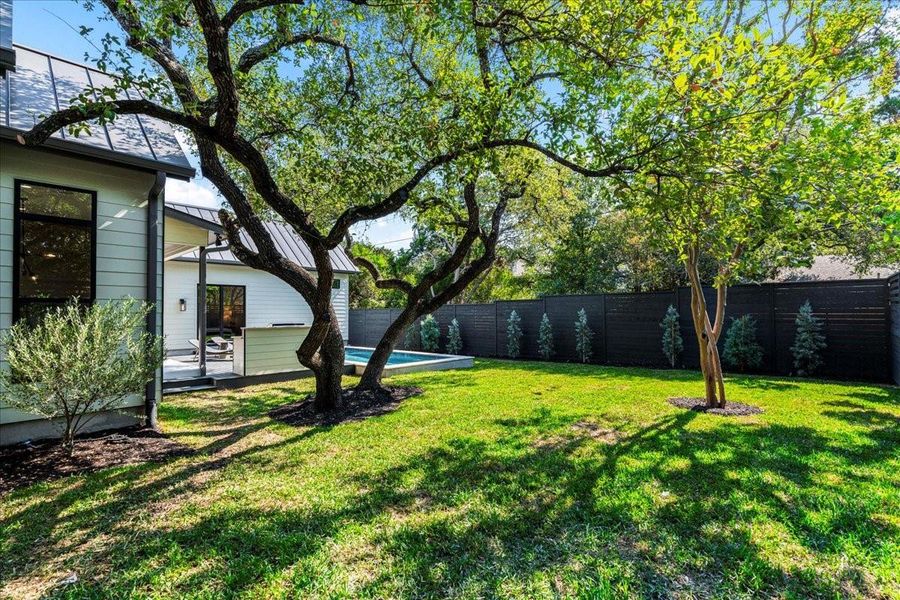 Large backyard with privacy fence