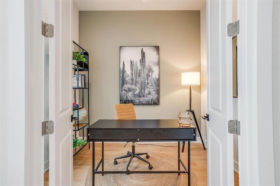 A bright and airy office space featuring elegant French doors that fill the room with natural light, creating an inviting and productive atmosphere.