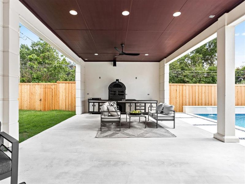View of patio / terrace featuring outdoor lounge area, ceiling fan, and a fenced in pool