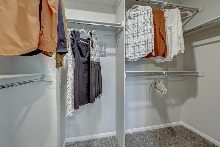 Adjacent to the shower lies the walk-in closet, a meticulously organized space that caters to your storage needs with ease. From clothing and accessories to linens and more, this closet provides ample room to keep your belongings tidy and accessible,