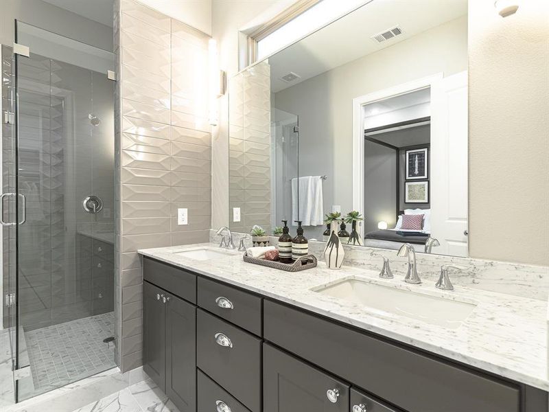 Primary bath dual vanities, over sized shower frameless glass door.