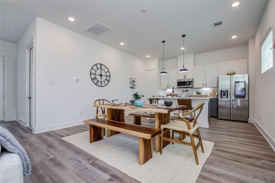 Enjoy the spacious dining area ideal for family and friends' gatherings! Model home photos - FINISHES AND LAYOUT MAY VARY! Ceiling fans are NOT INCLUDED!