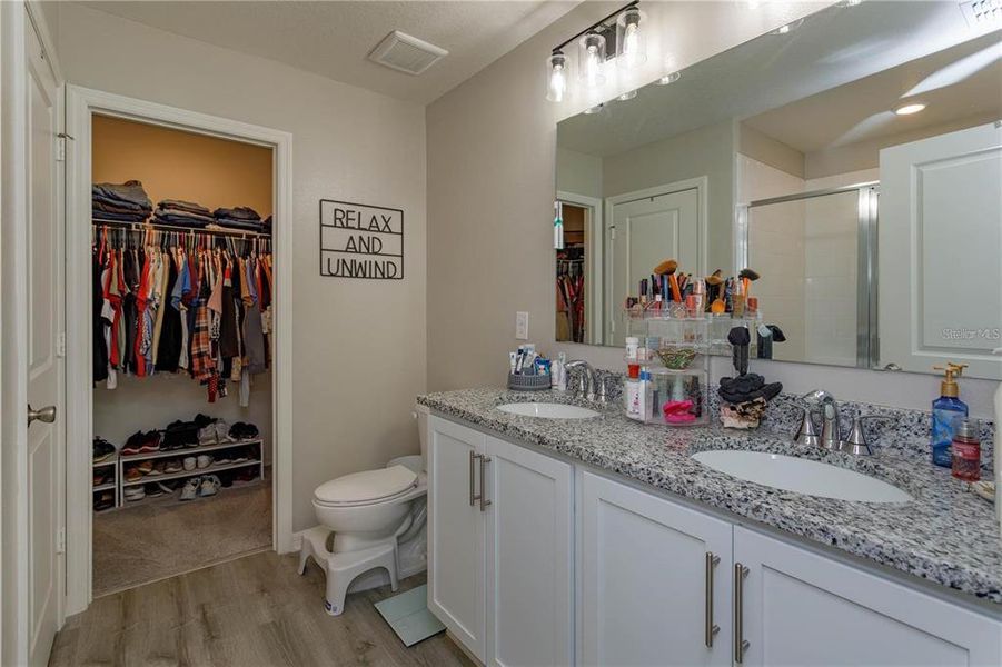 primary bath with walk-in closet