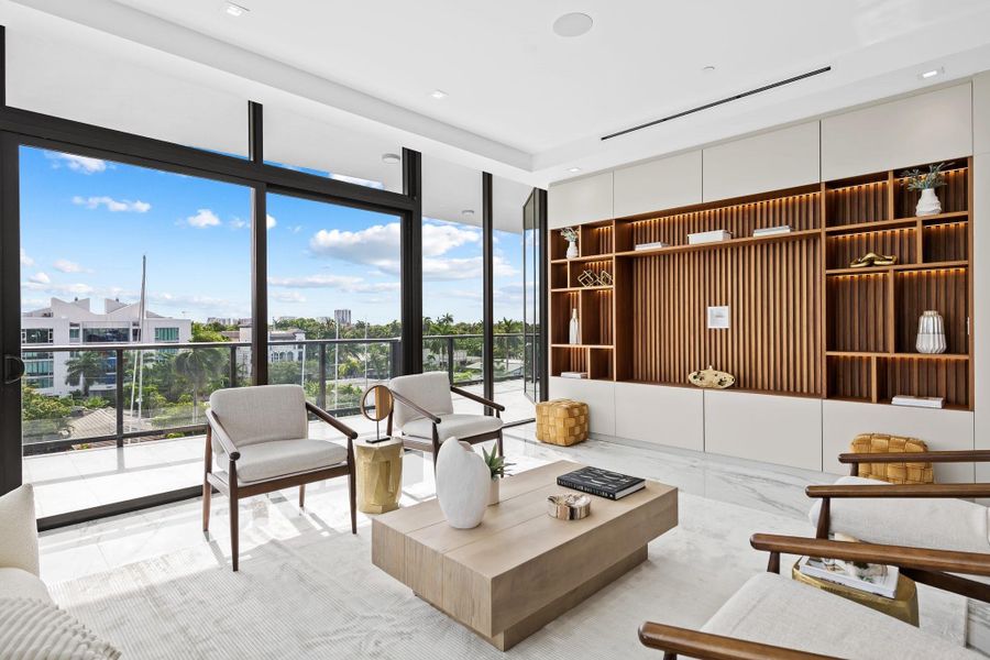 Spacious living room with 10' ceilings throughout penthouse