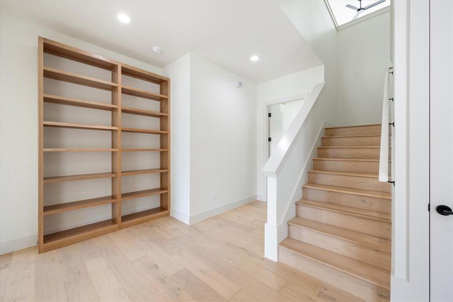 Staircase featuring light hardwood / wood-style floors