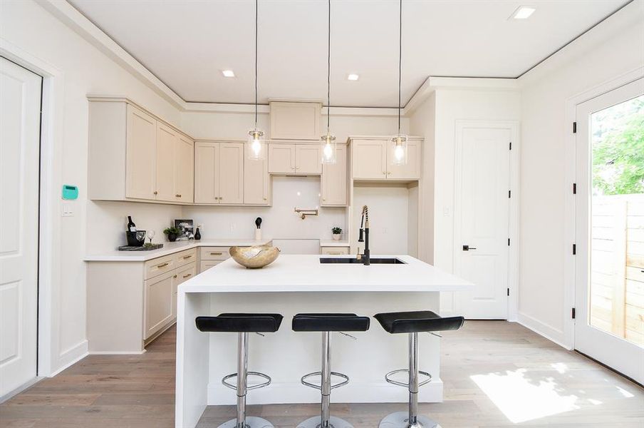 This collection of finishes features hardwood, pure white quartz counters and soft neutral custom cabinets with soft close