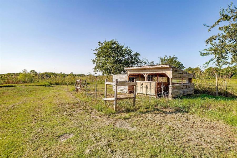 View of outbuilding with a rural view